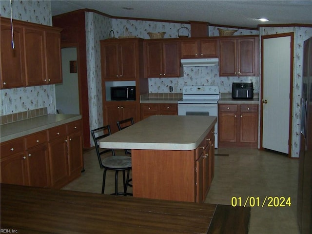 34026 Doctors Rd, Newsoms, VA 23874 - kitchen with under cabinet range hood, crown molding, black microwave, white electric range, and wallpapered walls