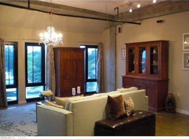 living room with an inviting chandelier and a healthy amount of sunlight