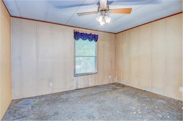 empty room with ceiling fan and ornamental molding