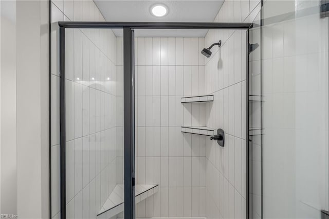 bathroom featuring an enclosed shower