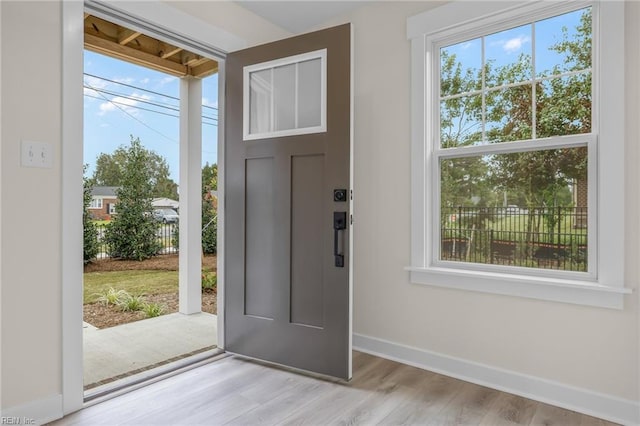 entryway featuring elevator and light hardwood / wood-style flooring