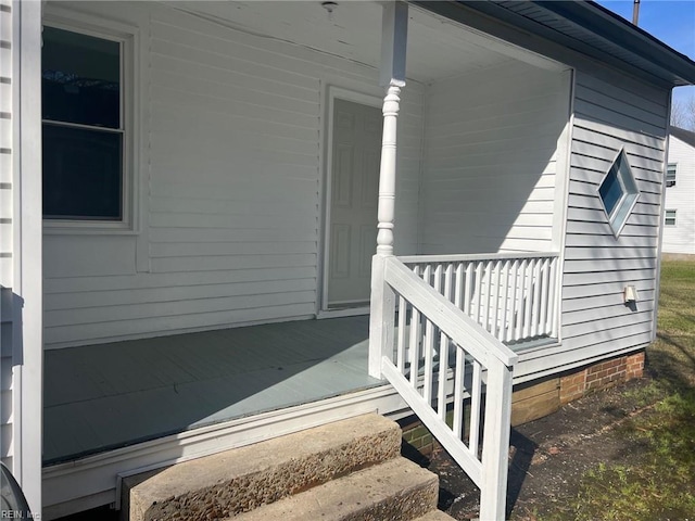 property entrance featuring covered porch