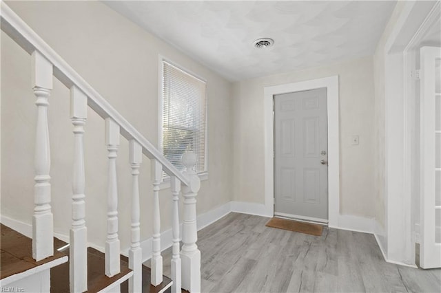 entrance foyer with light hardwood / wood-style flooring