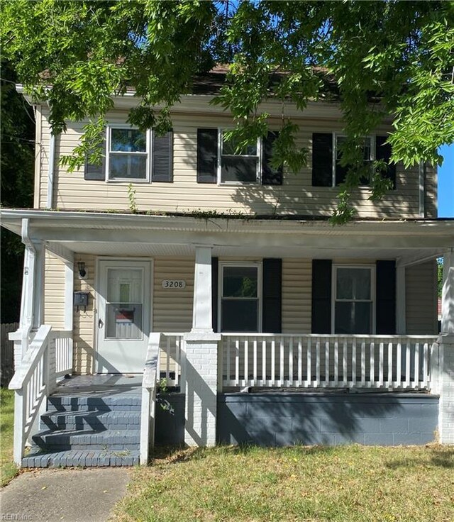 view of front of property featuring covered porch