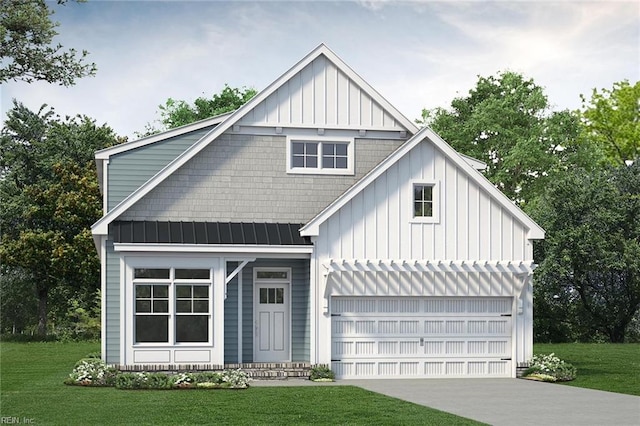 view of front of home with a garage and a front lawn