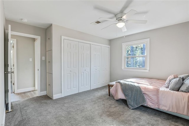 bedroom featuring ceiling fan, a closet, and carpet floors