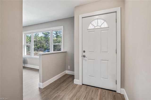 foyer entrance featuring a healthy amount of sunlight and light wood-type flooring