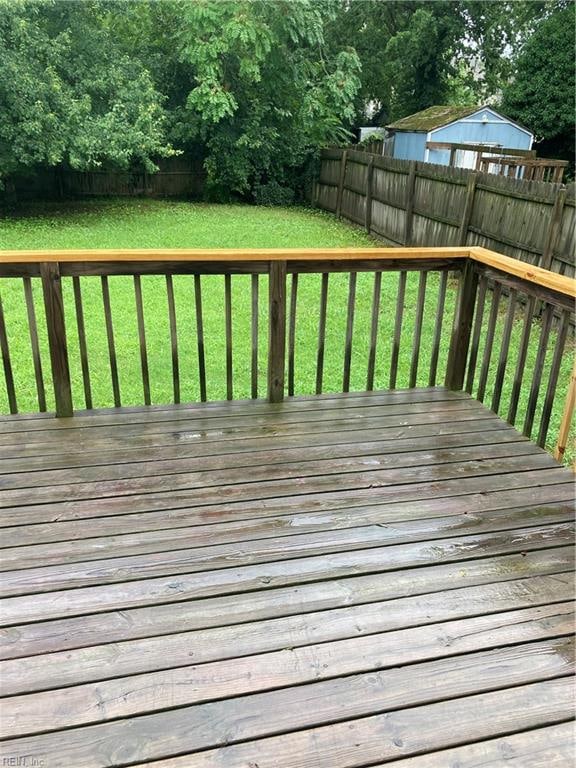 wooden terrace with a yard