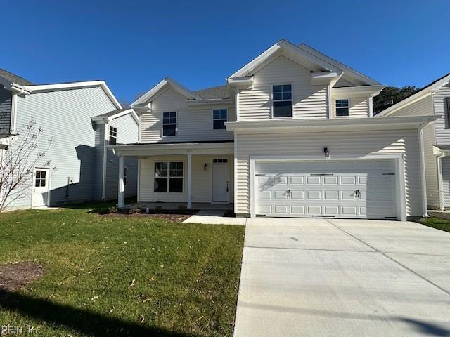 view of front of home featuring a garage and a front lawn