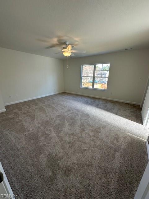 spacious closet featuring dark carpet