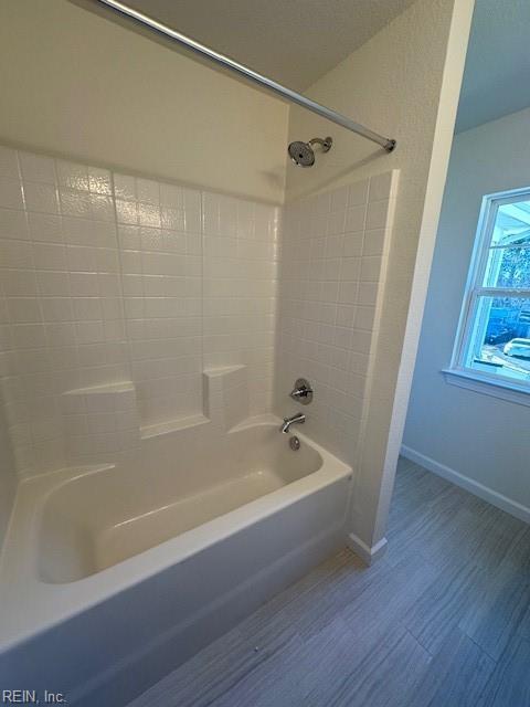 bathroom featuring shower / washtub combination