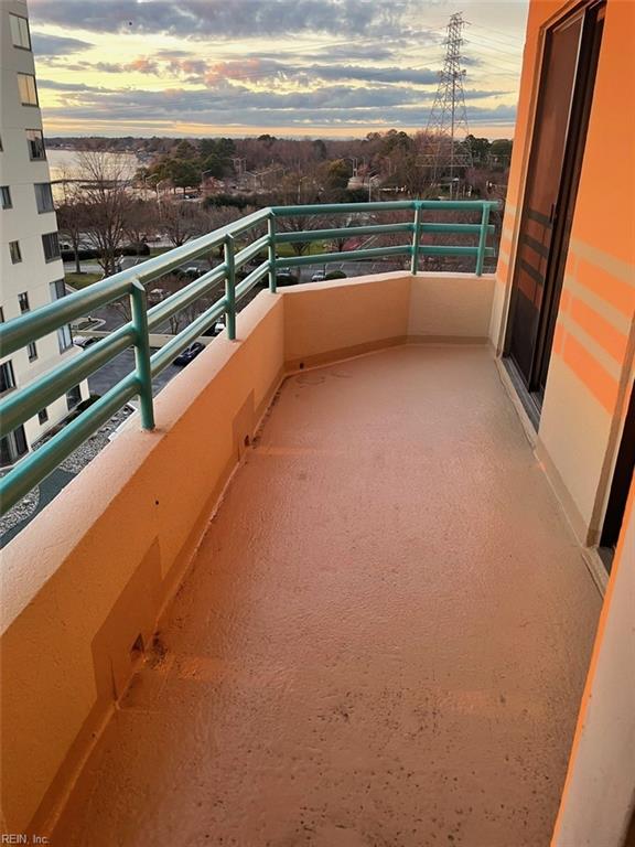 view of balcony at dusk