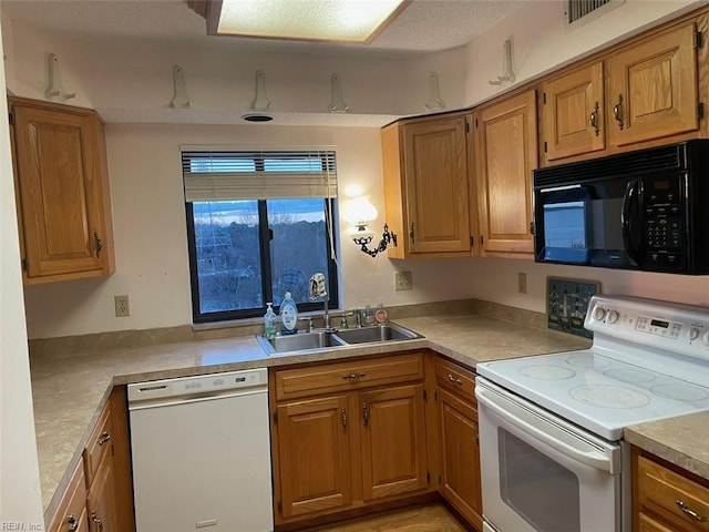 kitchen with white appliances and sink