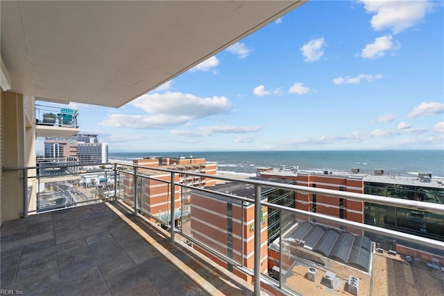 balcony featuring a water view