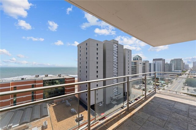 balcony featuring a water view