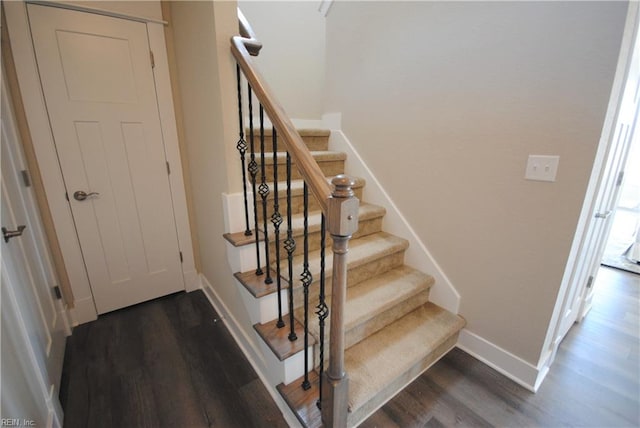 stairway featuring dark hardwood / wood-style flooring