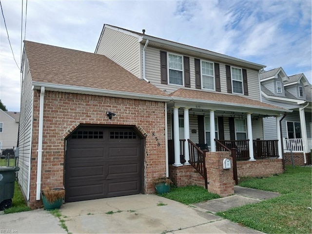 view of front of property with a garage and covered porch