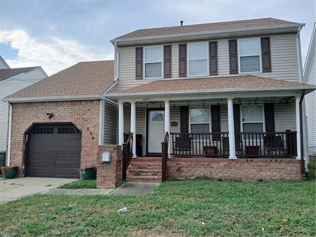 view of front facade featuring a porch, a garage, and a front yard