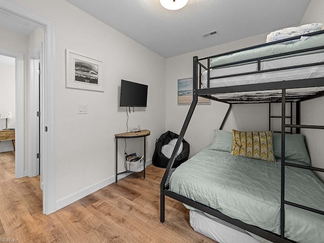 bedroom featuring light hardwood / wood-style floors