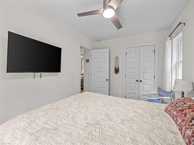 bedroom featuring ceiling fan and a closet