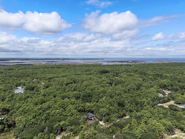 bird's eye view with a water view and a beach view