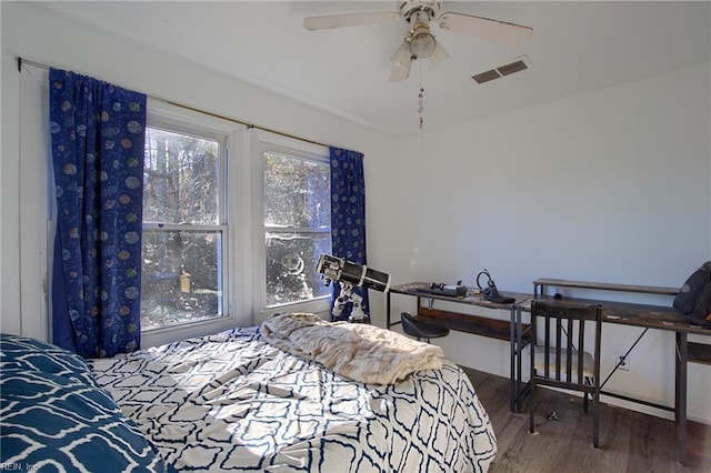 bedroom with hardwood / wood-style flooring and ceiling fan