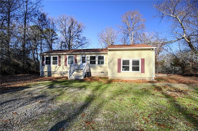 single story home featuring a front lawn