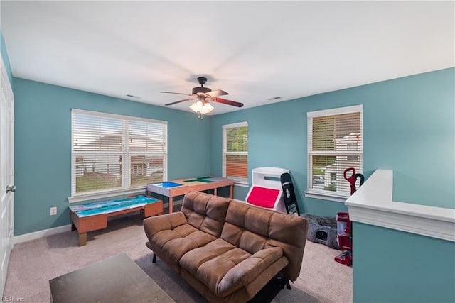 living room with carpet floors and ceiling fan