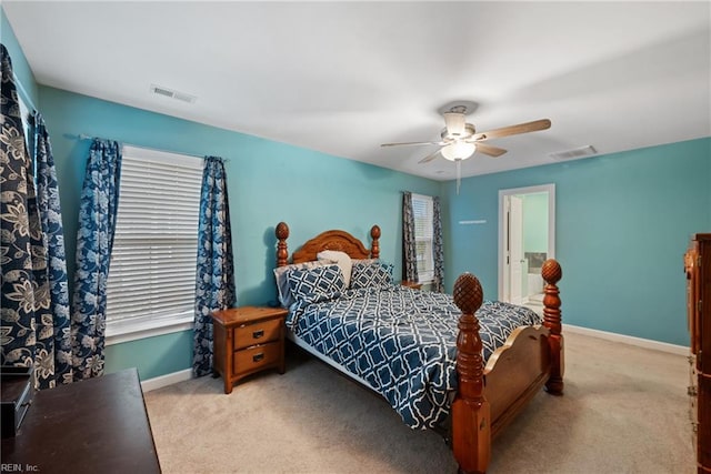 bedroom featuring ceiling fan and light colored carpet