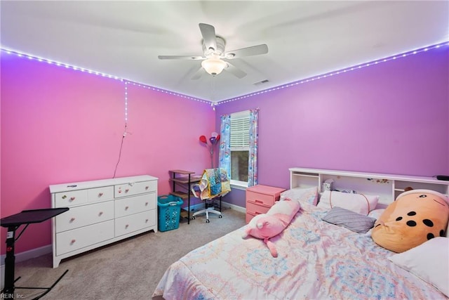 bedroom featuring light colored carpet and ceiling fan