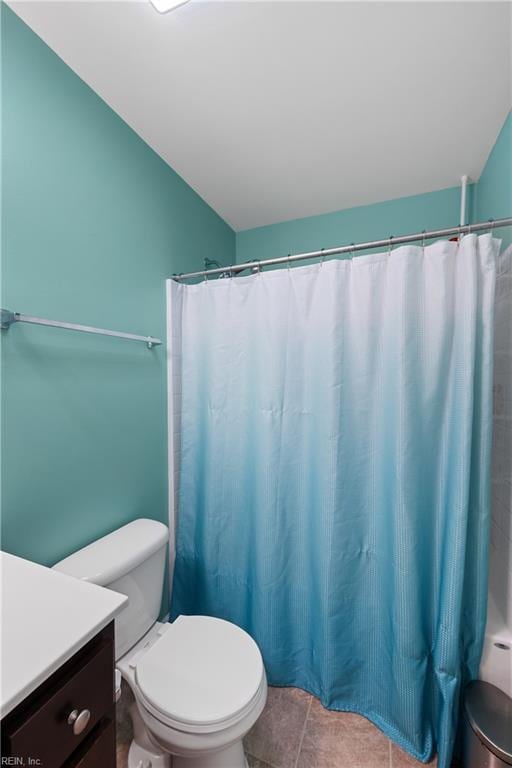 bathroom with tile patterned floors, vanity, and toilet