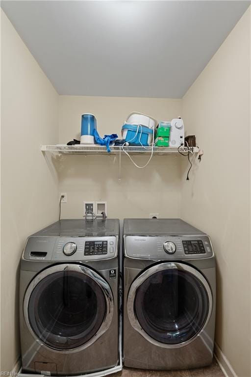 laundry room with independent washer and dryer