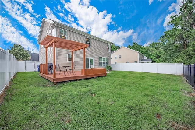 back of property featuring a deck, a lawn, and a pergola