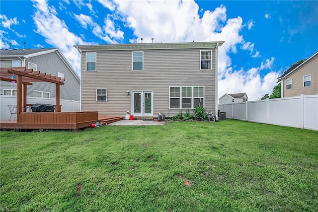 back of property featuring a pergola, a lawn, a deck, central AC unit, and a patio area