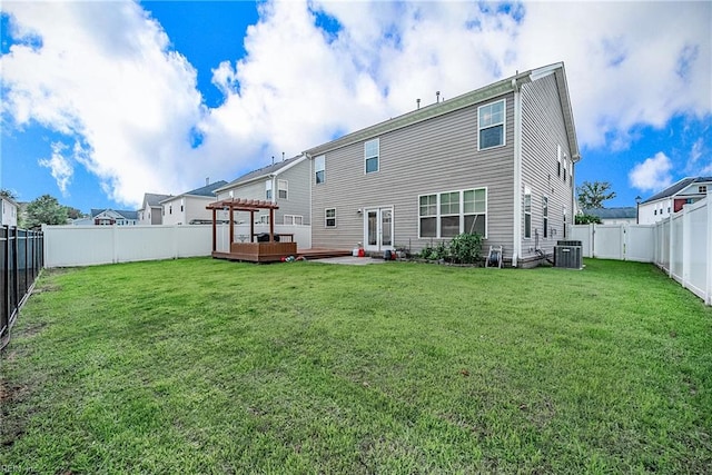 rear view of property with a pergola, central AC, a deck, and a yard