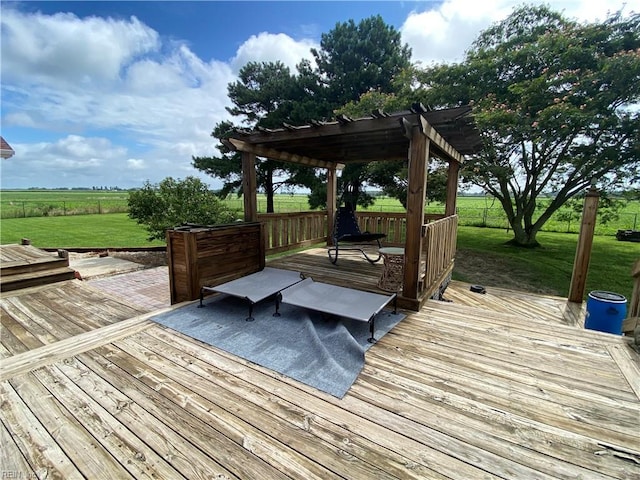 wooden terrace with a yard and a pergola