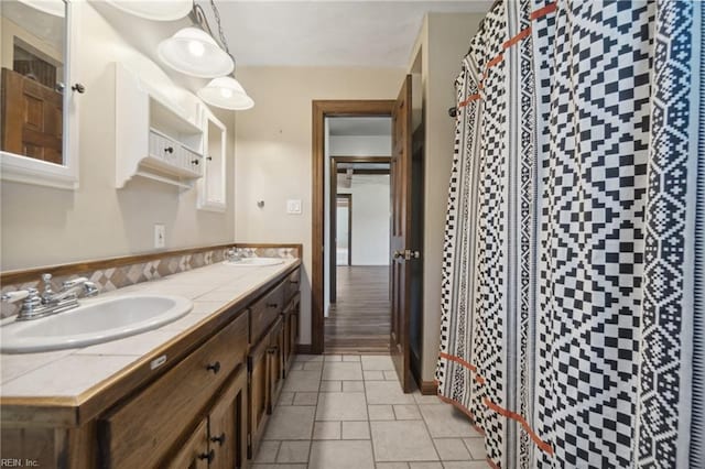 bathroom featuring curtained shower, hardwood / wood-style flooring, and vanity