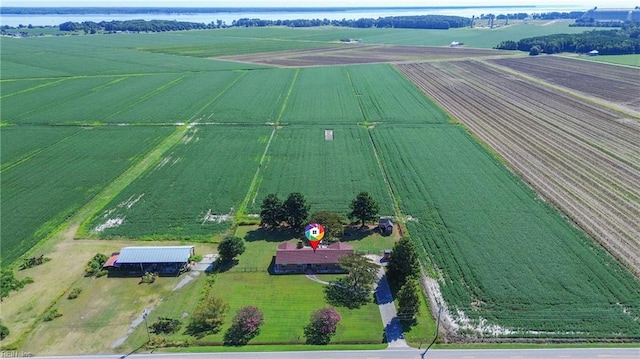 birds eye view of property with a rural view