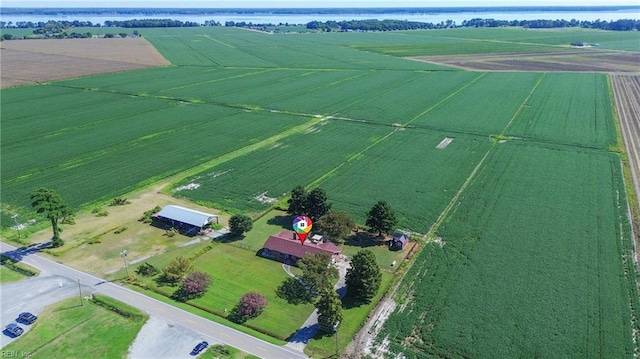 birds eye view of property with a rural view