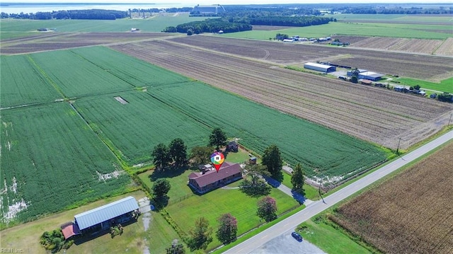 birds eye view of property featuring a rural view