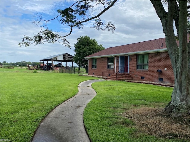 view of front of home with a front lawn and a gazebo