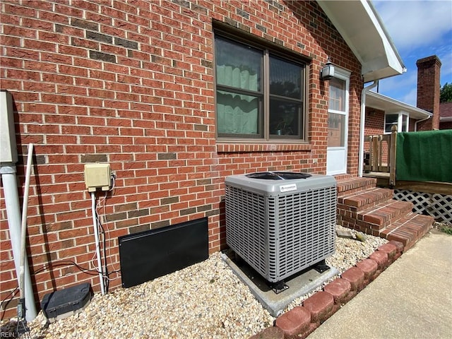 details featuring central AC unit and carpet flooring