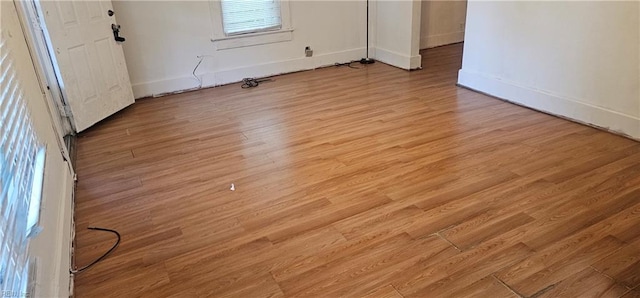 unfurnished room with light hardwood / wood-style flooring