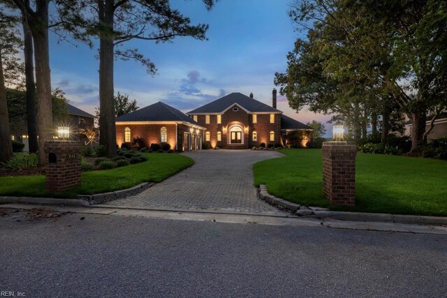 view of front of house with a yard