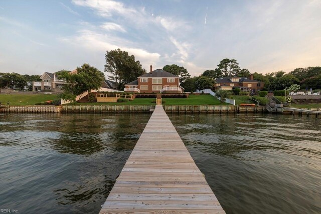 dock area with a water view