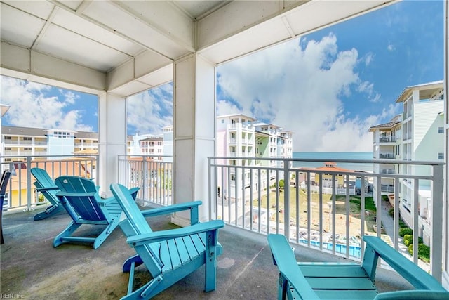 balcony featuring a water view