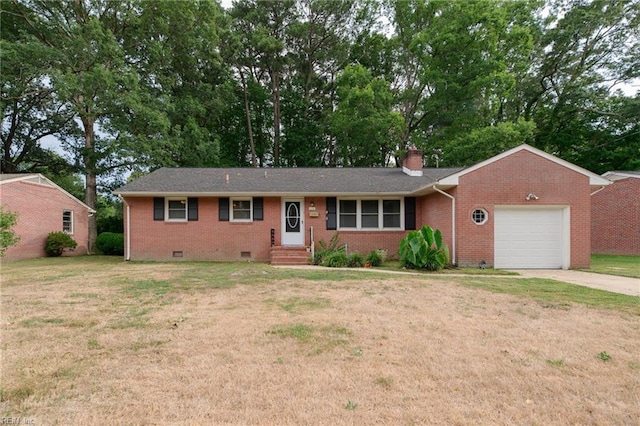 ranch-style house featuring a garage and a front lawn