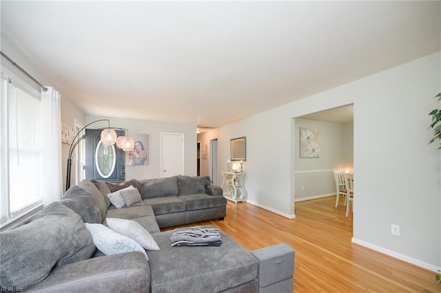 living room with light hardwood / wood-style flooring