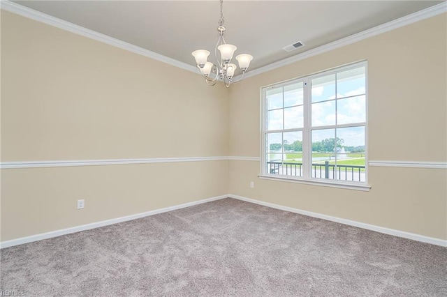 empty room featuring an inviting chandelier, plenty of natural light, carpet, and ornamental molding