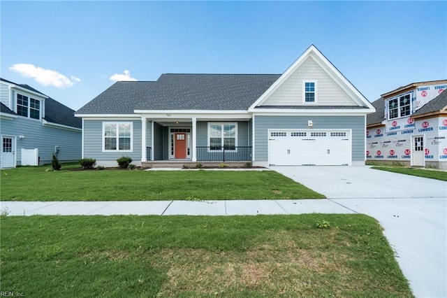 view of front of house with a garage and a front lawn